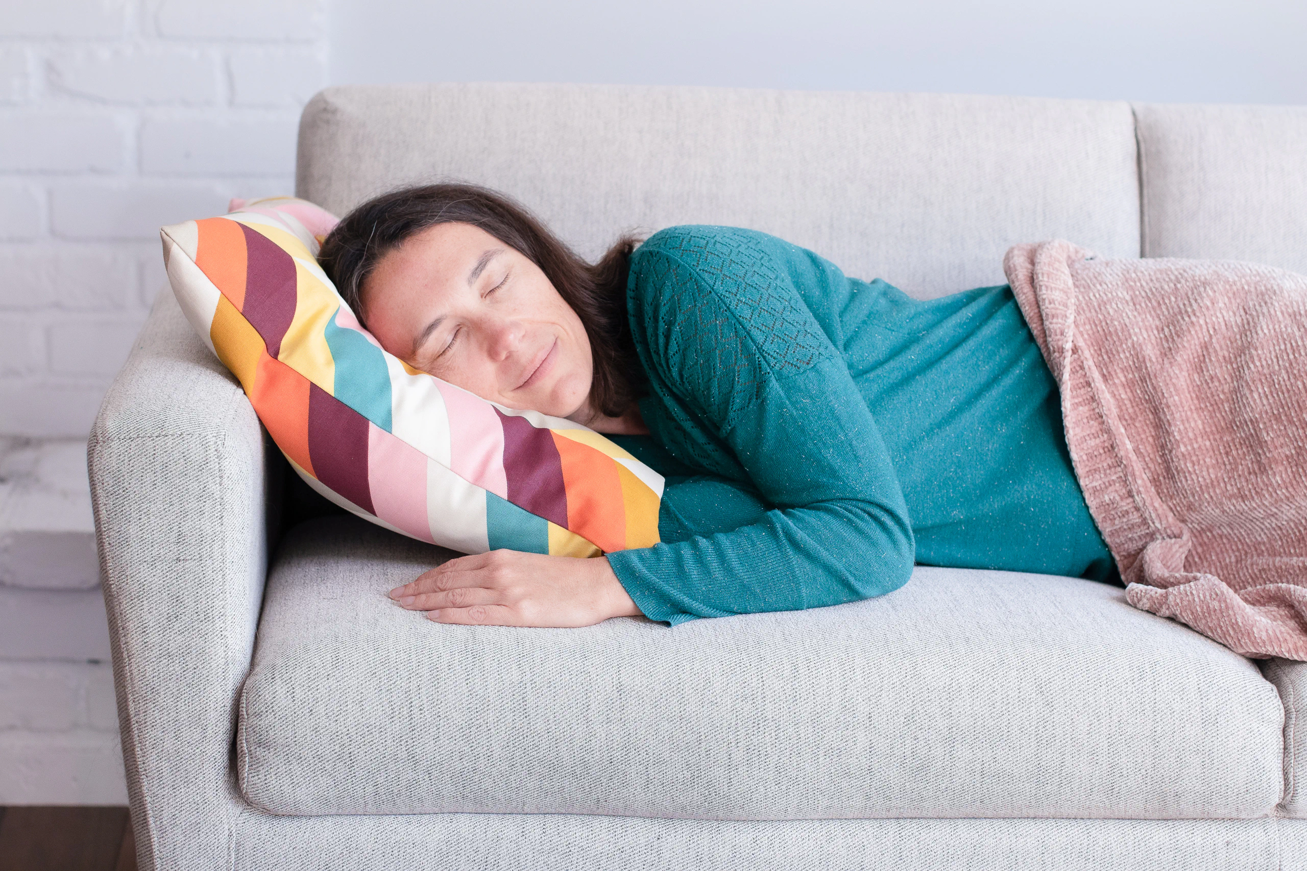 Person lying in bed awake at 3 a.m., finding calm through hypnosis to fall back asleep